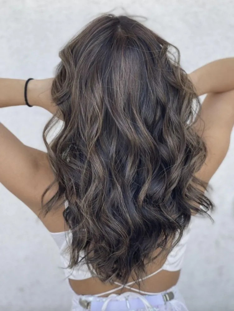 Brunette bronde with rich dimension and soft ribboning, finished at The Beauty Suite.