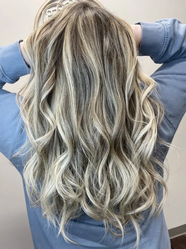Bright, dimensional blonde with soft face-framing highlights and healthy shine